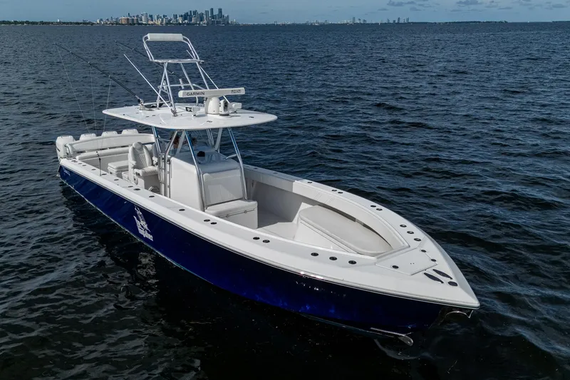 The Hogfather Yacht Photos Pics 2015 Bahama 41 boat on open water with city skyline in background.