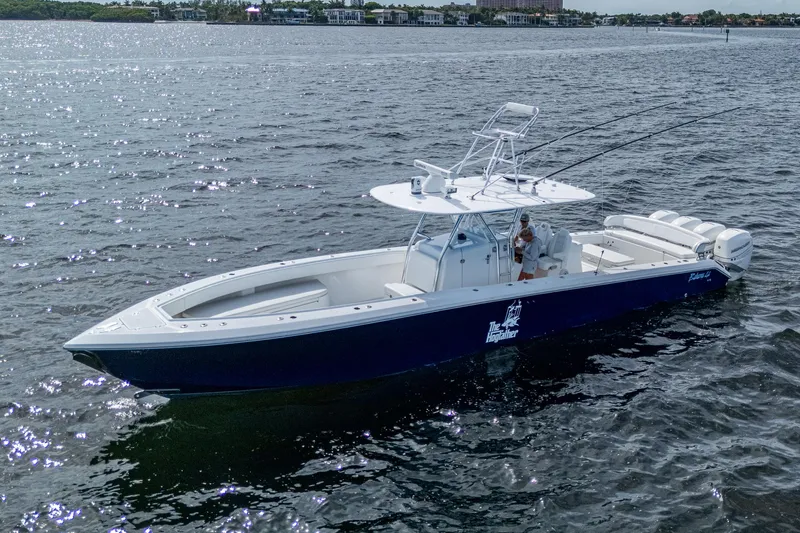 The Hogfather Yacht Photos Pics 2015 Bahama 41 boat on water, featuring sleek design and fishing equipment.