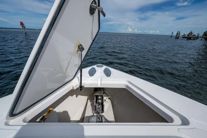The Hogfather Yacht Photos Pics Open anchor hatch on 2015 Bahama 41 boat, overlooking calm ocean waters.
