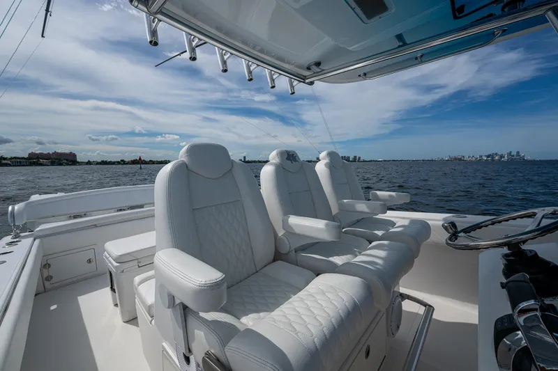 The Hogfather Yacht Photos Pics Luxurious seating on a 2015 Bahama 41 boat, overlooking a scenic ocean view.
