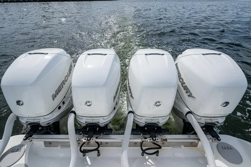 The Hogfather Yacht Photos Pics Four Mercury outboard engines on a 2015 Bahama 41 boat, cruising on open water.