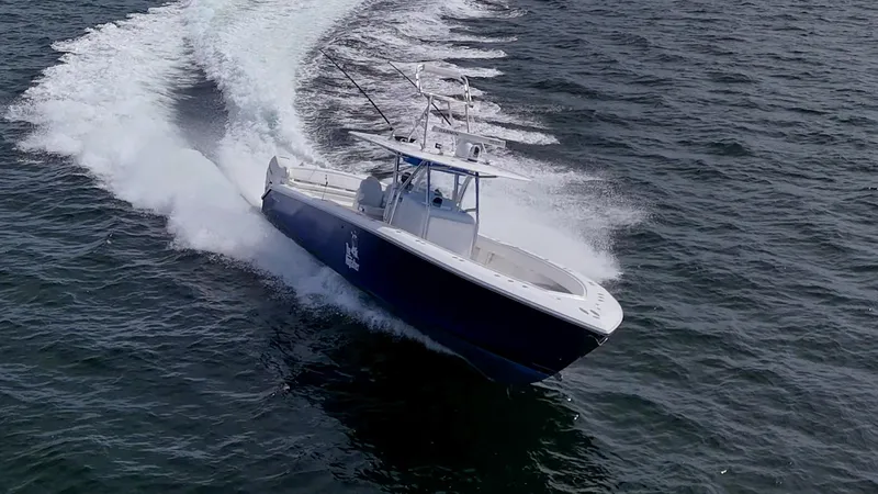 The Hogfather Yacht Photos Pics 2015 Bahama 41 boat cruising swiftly on open water, creating a dynamic wake.