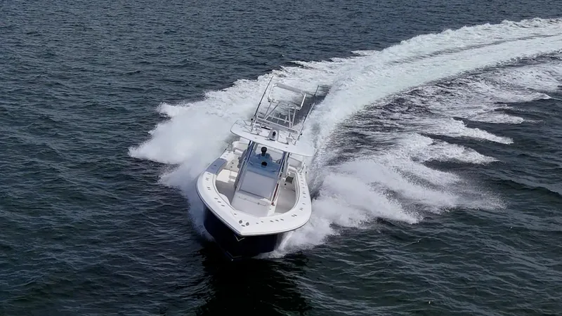 The Hogfather Yacht Photos Pics Aerial view of 2015 Bahama 41 boat speeding on open water.