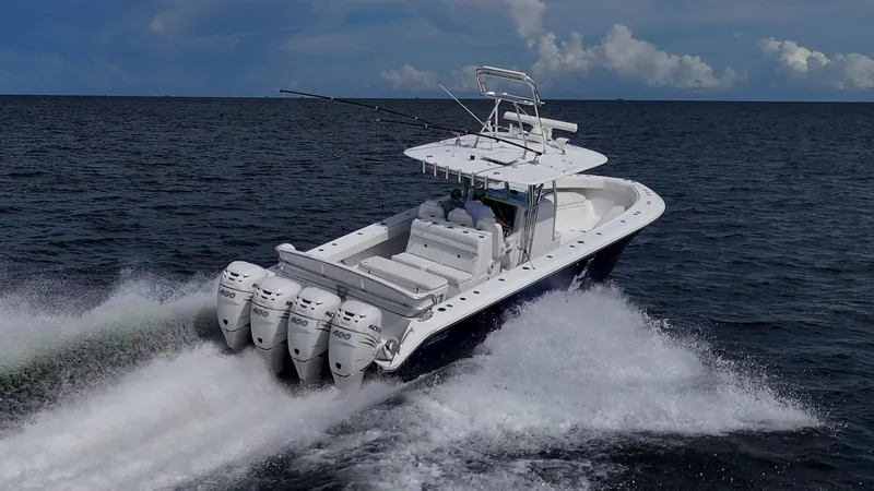 The Hogfather Yacht Photos Pics 2015 Bahama 41 boat cruising on open water with four powerful engines.