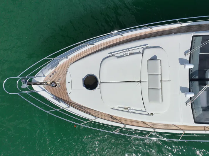 Warren Kelly Yacht Photos Pics Overhead view of 2010 Azimut 62S yacht on green water.