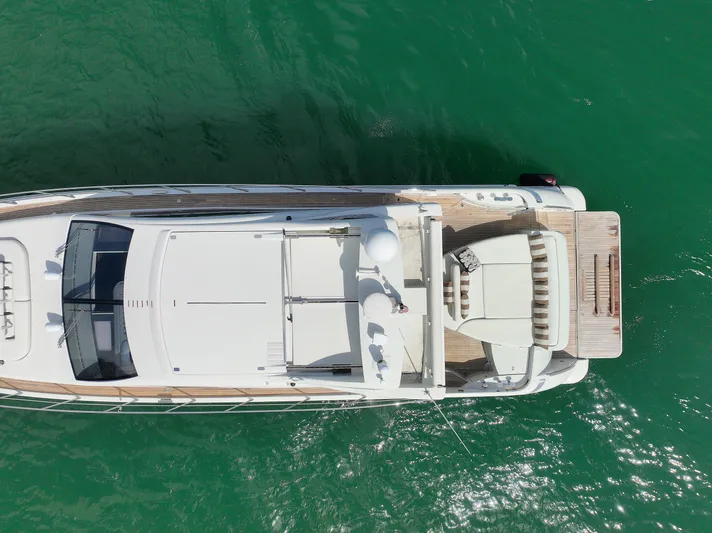 Warren Kelly Yacht Photos Pics Aerial view of 2010 Azimut 62S yacht on green water.