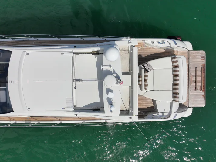 Warren Kelly Yacht Photos Pics Overhead view of a 2010 Azimut 62S yacht on green water.