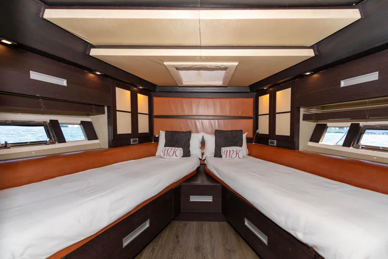 Warren Kelly Yacht Photos Pics Luxurious cabin interior of 2010 Azimut 62S yacht with twin beds and elegant design.