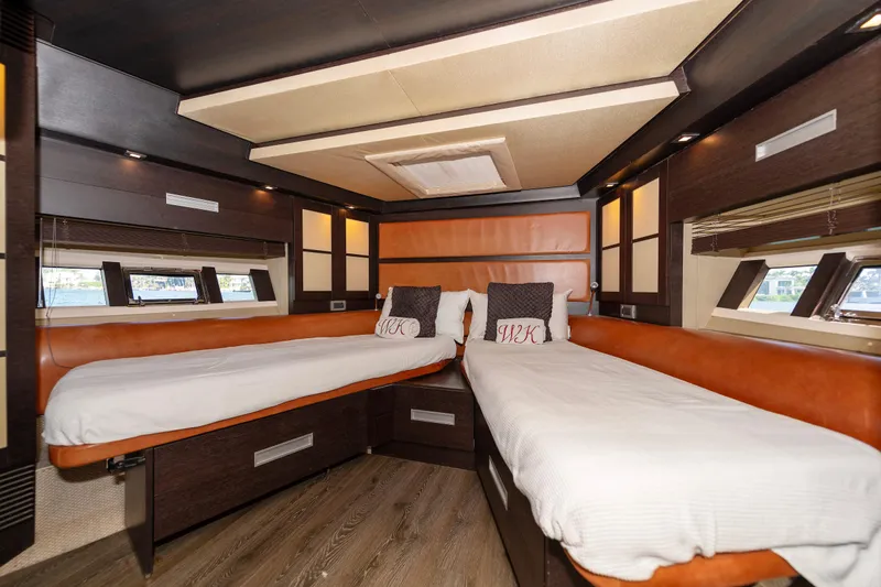 Warren Kelly Yacht Photos Pics Luxurious cabin interior of 2010 Azimut 62S yacht with twin beds and modern design.