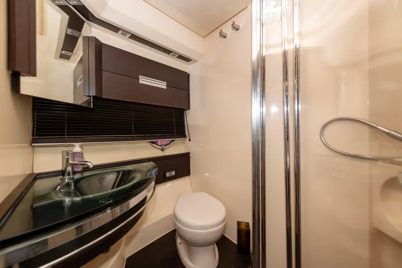 Warren Kelly Yacht Photos Pics Luxurious bathroom in 2010 Azimut 62S yacht with modern fixtures and elegant design.