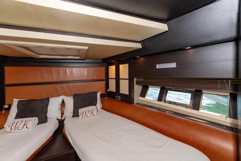 Warren Kelly Yacht Photos Pics Luxurious interior of 2010 Azimut 62S yacht with twin beds and ocean view.