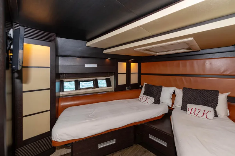 Warren Kelly Yacht Photos Pics Luxurious cabin interior of 2010 Azimut 62S yacht with twin beds and modern design.
