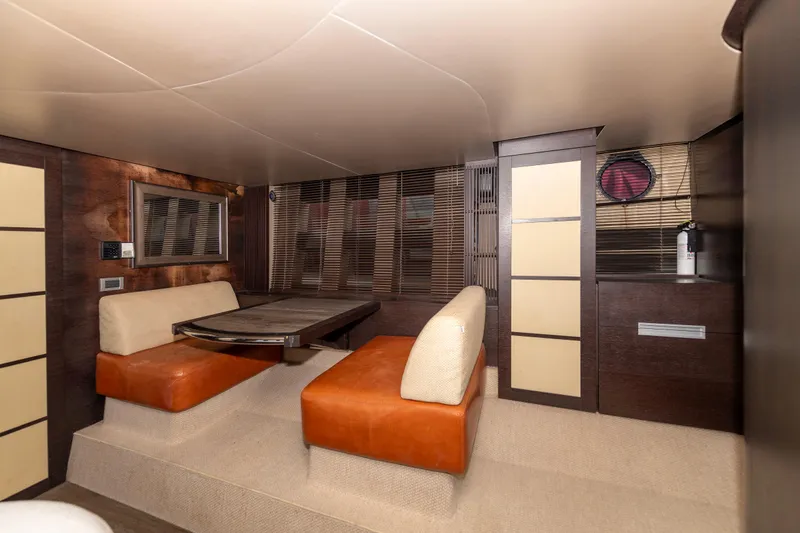 Warren Kelly Yacht Photos Pics Interior of 2010 Azimut 62S yacht with modern seating and dining area.