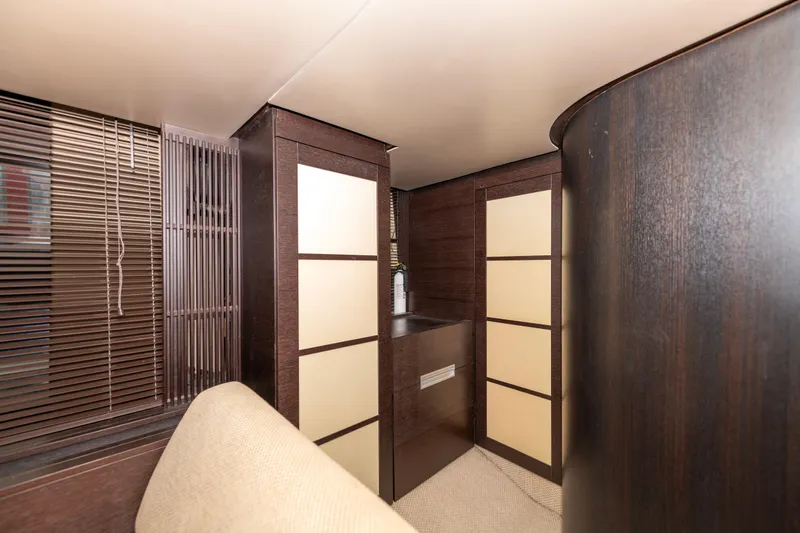 Warren Kelly Yacht Photos Pics Interior of 2010 Azimut 62S yacht with modern wood paneling and beige accents.