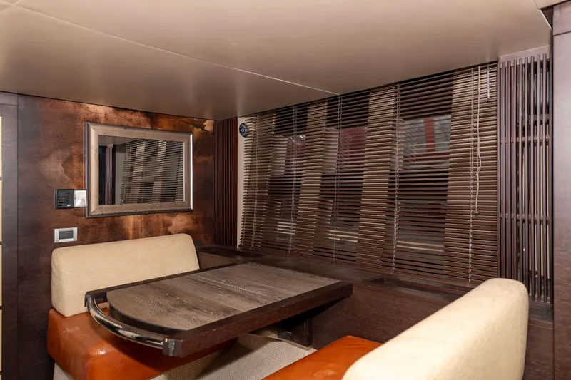 Warren Kelly Yacht Photos Pics Interior of 2010 Azimut 62S yacht with dining area and modern decor.