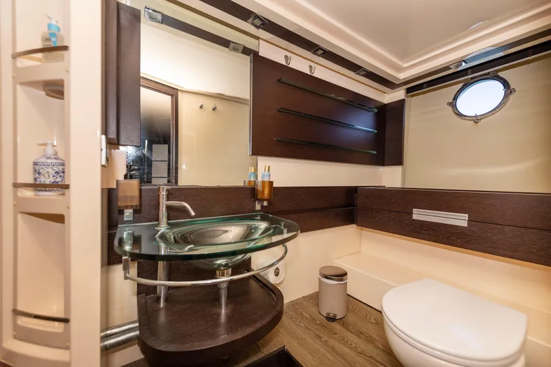 Warren Kelly Yacht Photos Pics Luxurious bathroom in 2010 Azimut 62S yacht with modern fixtures and elegant design.