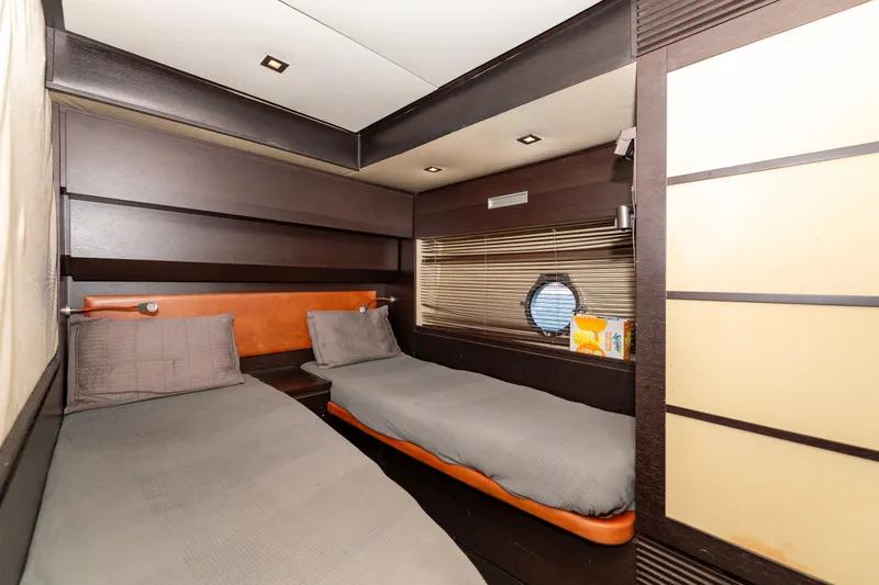 Warren Kelly Yacht Photos Pics Interior of 2010 Azimut 62S yacht cabin with twin beds and modern design.