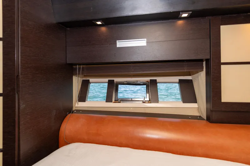 Warren Kelly Yacht Photos Pics Luxurious cabin interior of 2010 Azimut 62S yacht with ocean view window.