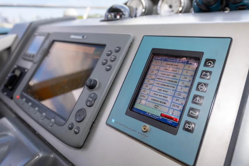 Warren Kelly Yacht Photos Pics Dashboard of a 2010 Azimut 62S yacht with navigation and control screens.