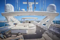 Luxurious 2005 Custom Line 112 yacht deck with modern seating and ocean view.