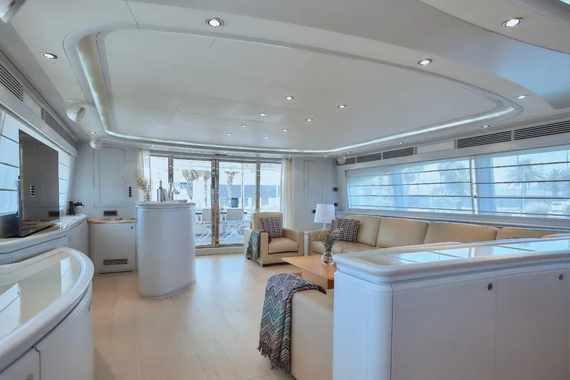 Camarik Yacht Photos Pics Luxurious interior of 2005 Custom Line 112 yacht with modern furnishings and ample natural light.