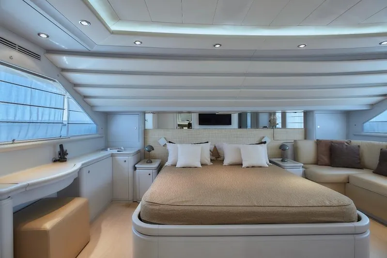 Camarik Yacht Photos Pics Luxurious yacht bedroom interior with modern design, featuring a comfortable bed and elegant seating area.
