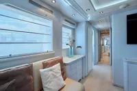 Luxurious interior of a 2005 Custom Line 112 yacht, featuring elegant seating and modern decor.