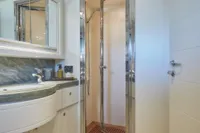 Luxurious yacht bathroom with modern shower and elegant sink, Custom Line 112, 2005 model.