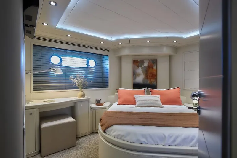 Camarik Yacht Photos Pics Luxurious yacht bedroom with modern decor, featuring a cozy bed and ambient lighting.