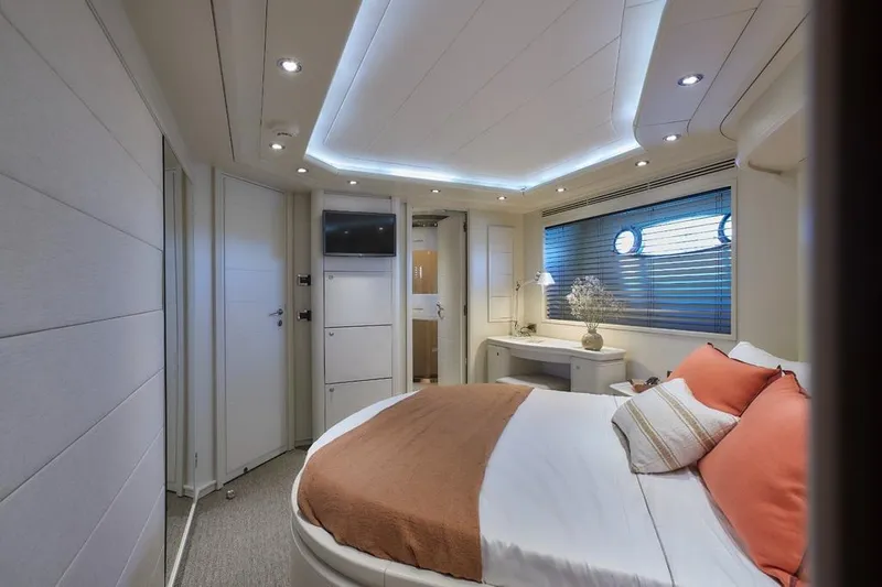 Camarik Yacht Photos Pics Luxurious yacht bedroom with modern decor, featuring a cozy bed and ambient lighting, Custom Line 112.