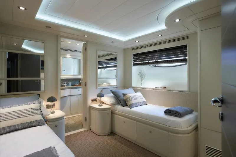 Camarik Yacht Photos Pics Luxurious yacht bedroom with modern design, featuring twin beds and ambient lighting, Custom Line 112, 2005.