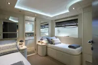 Luxurious yacht bedroom with modern design, featuring twin beds and ambient lighting, Custom Line 112, 2005.