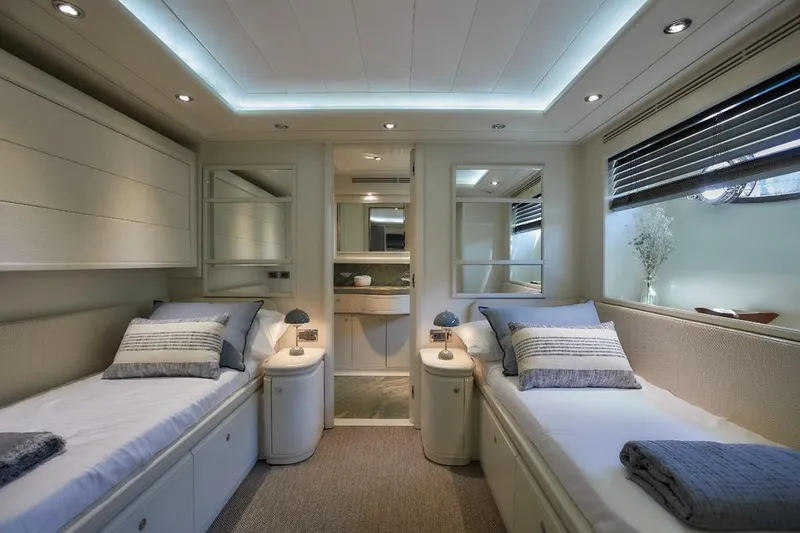 Camarik Yacht Photos Pics Luxurious twin cabin interior on a 2005 Custom Line 112 yacht, featuring modern decor.