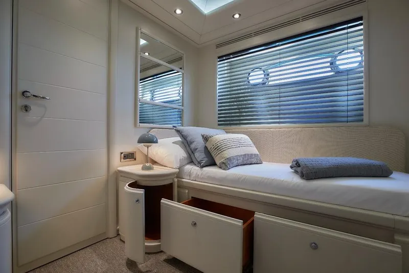 Camarik Yacht Photos Pics Luxurious yacht bedroom with modern decor, featuring a single bed and ample storage.