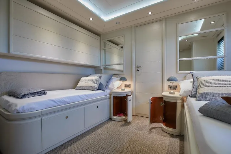 Camarik Yacht Photos Pics Luxurious twin cabin interior on 2005 Custom Line 112 yacht, featuring elegant decor and modern amenities.