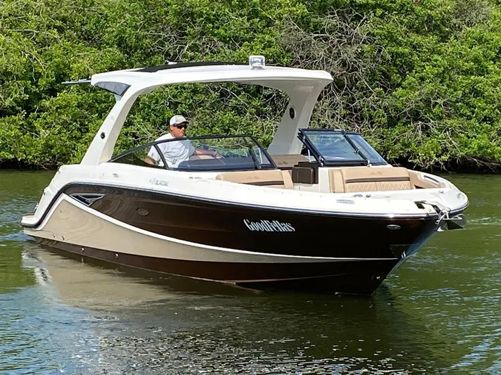 2017 Sea Ray 310 Slx @ Puerto Vallarta Yacht Photos Pics 2017 Sea Ray 310 SLX boat cruising on a calm river with lush greenery.