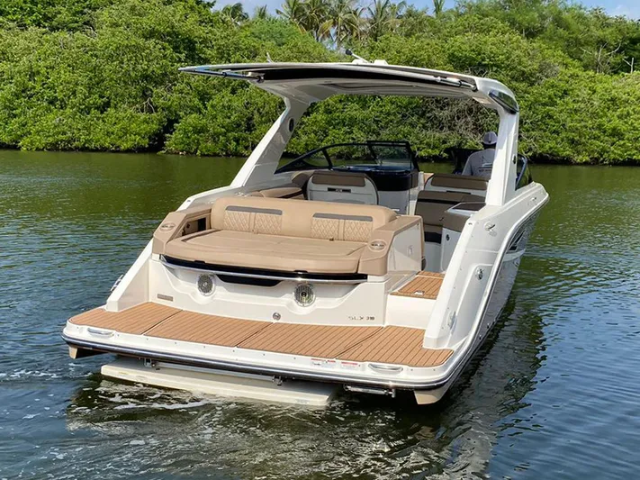 2017 Sea Ray 310 Slx @ Puerto Vallarta Yacht Photos Pics 2017 Sea Ray 310 SLX boat on calm water, featuring spacious seating and sleek design.