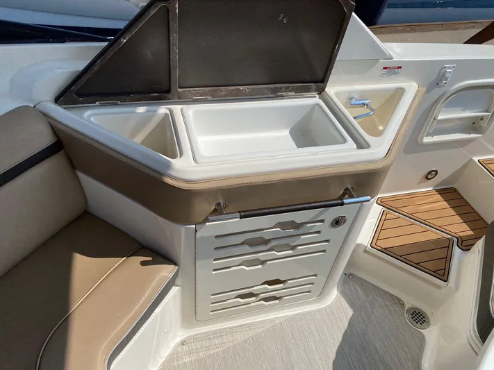 2017 Sea Ray 310 Slx @ Puerto Vallarta Yacht Photos Pics 2017 Sea Ray 310 SLX boat interior with seating, storage, and sink area.