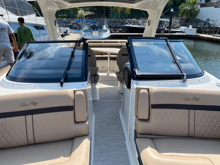 2017 Sea Ray 310 Slx @ Puerto Vallarta Yacht Photos Pics 2017 Sea Ray 310 SLX boat interior with beige seating and glass windshields.