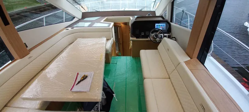  Yacht Photos Pics Interior of 2024 Galeon 500 Fly yacht with modern seating and helm station.