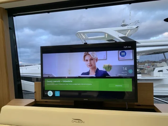  Yacht Photos Pics Interior of 2024 Galeon 500 Fly yacht with TV and marina view.