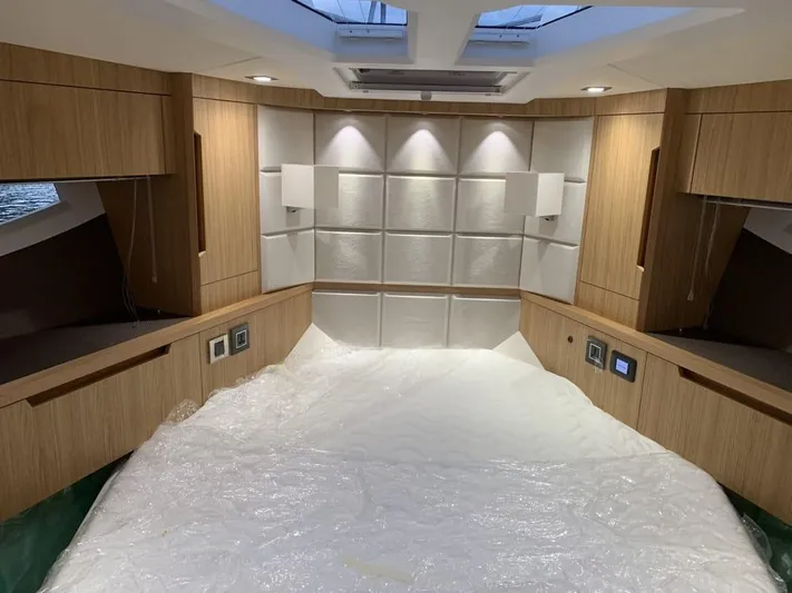  Yacht Photos Pics Luxurious interior of 2024 Galeon 500 Fly yacht with modern wood paneling and ambient lighting.