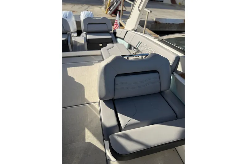  Yacht Photos Pics 2024 Regal LX9 boat interior with luxurious gray seating and modern design.