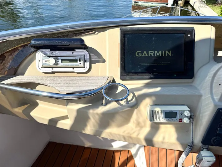 Craver Yacht Photos Pics 2001 Carver 396 Motor Yacht helm with Garmin navigation system and radio controls.