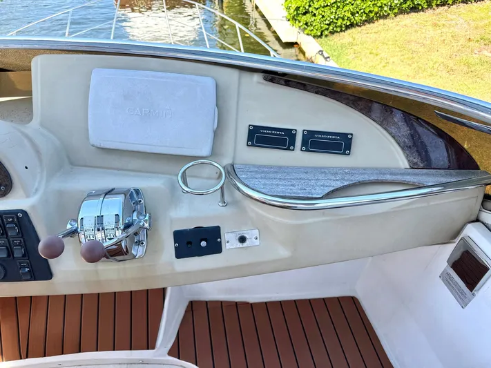 Craver Yacht Photos Pics 2001 Carver 396 Motor Yacht helm with controls and wooden deck accents.