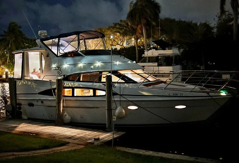 Craver Yacht Photos Pics 2001 Carver 396 Motor Yacht docked at night, illuminated with interior lights.
