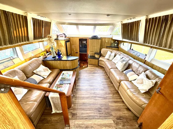 Craver Yacht Photos Pics Luxurious interior of 2001 Carver 396 Motor Yacht with plush seating and elegant decor.