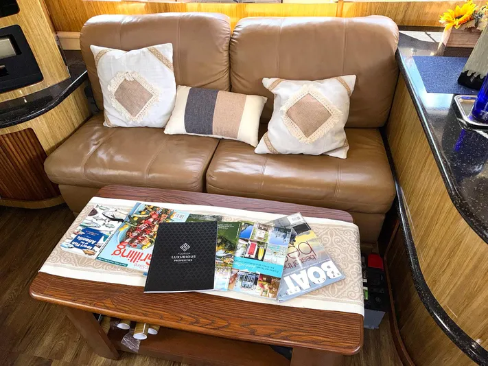 Craver Yacht Photos Pics Luxurious 2001 Carver 396 Motor Yacht interior with leather sofa and decorative pillows.