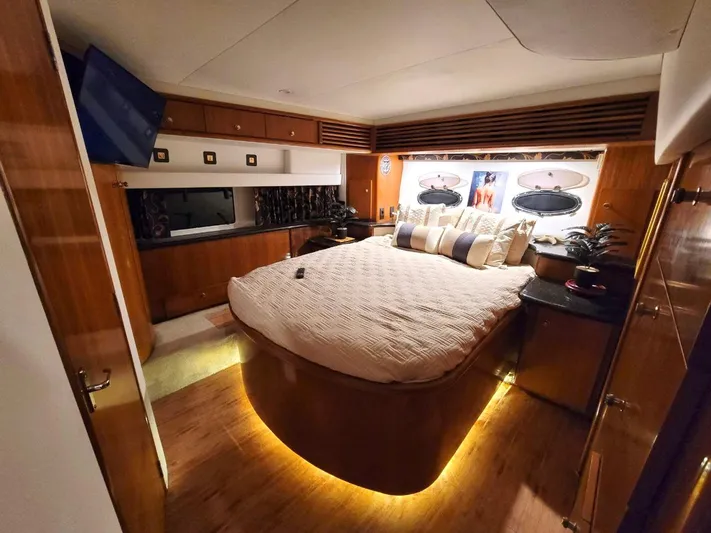 Craver Yacht Photos Pics Luxurious bedroom interior of 2001 Carver 396 Motor Yacht with ambient lighting.
