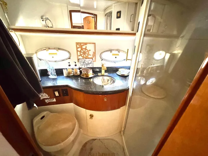 Craver Yacht Photos Pics Luxurious bathroom in 2001 Carver 396 Motor Yacht with elegant fixtures and decor.